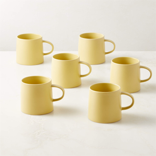 set of soft yellow mugs
