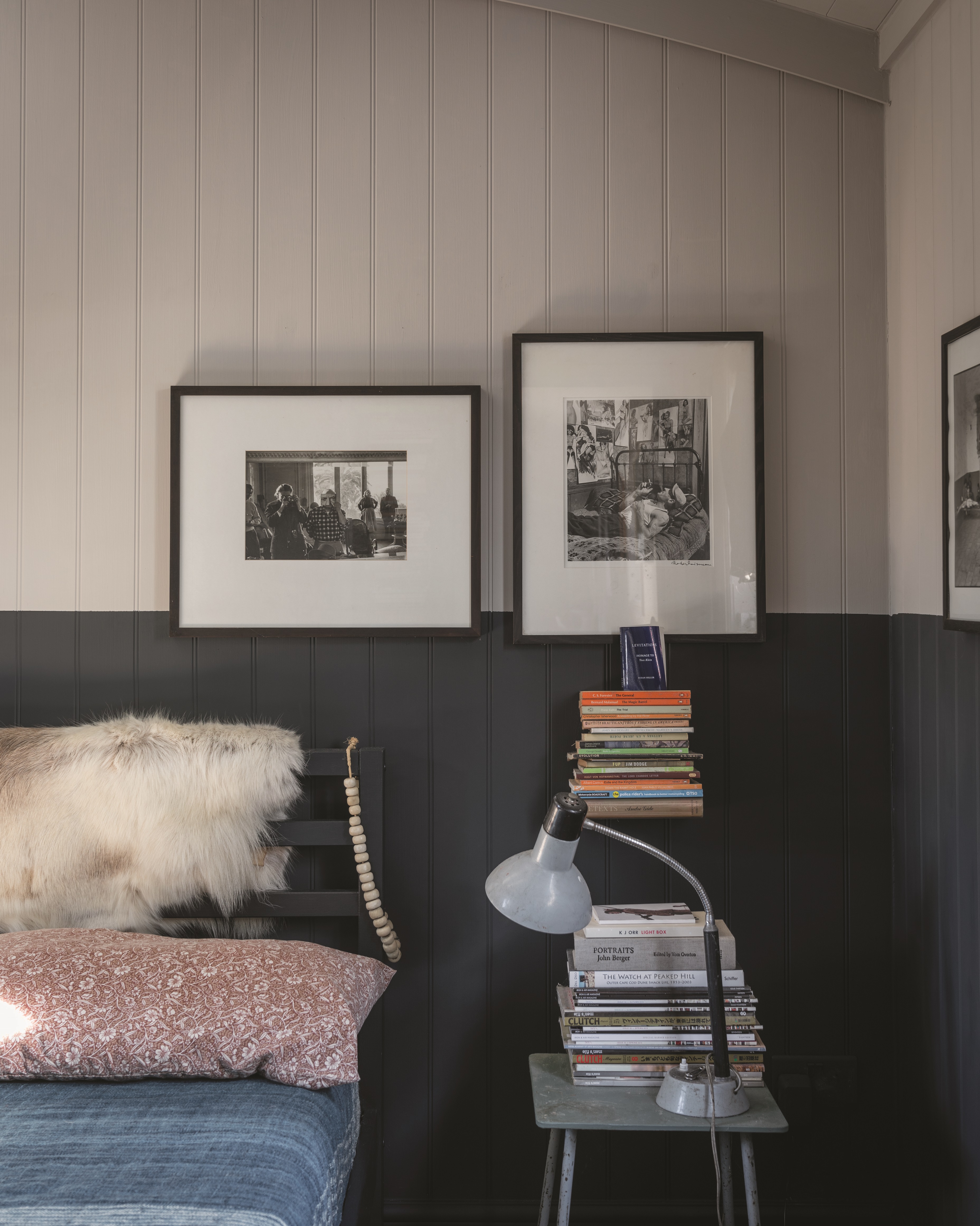 A bedroom with shiplap wall paneling painted in Farrow and Ball Railing and Estate Eggshell