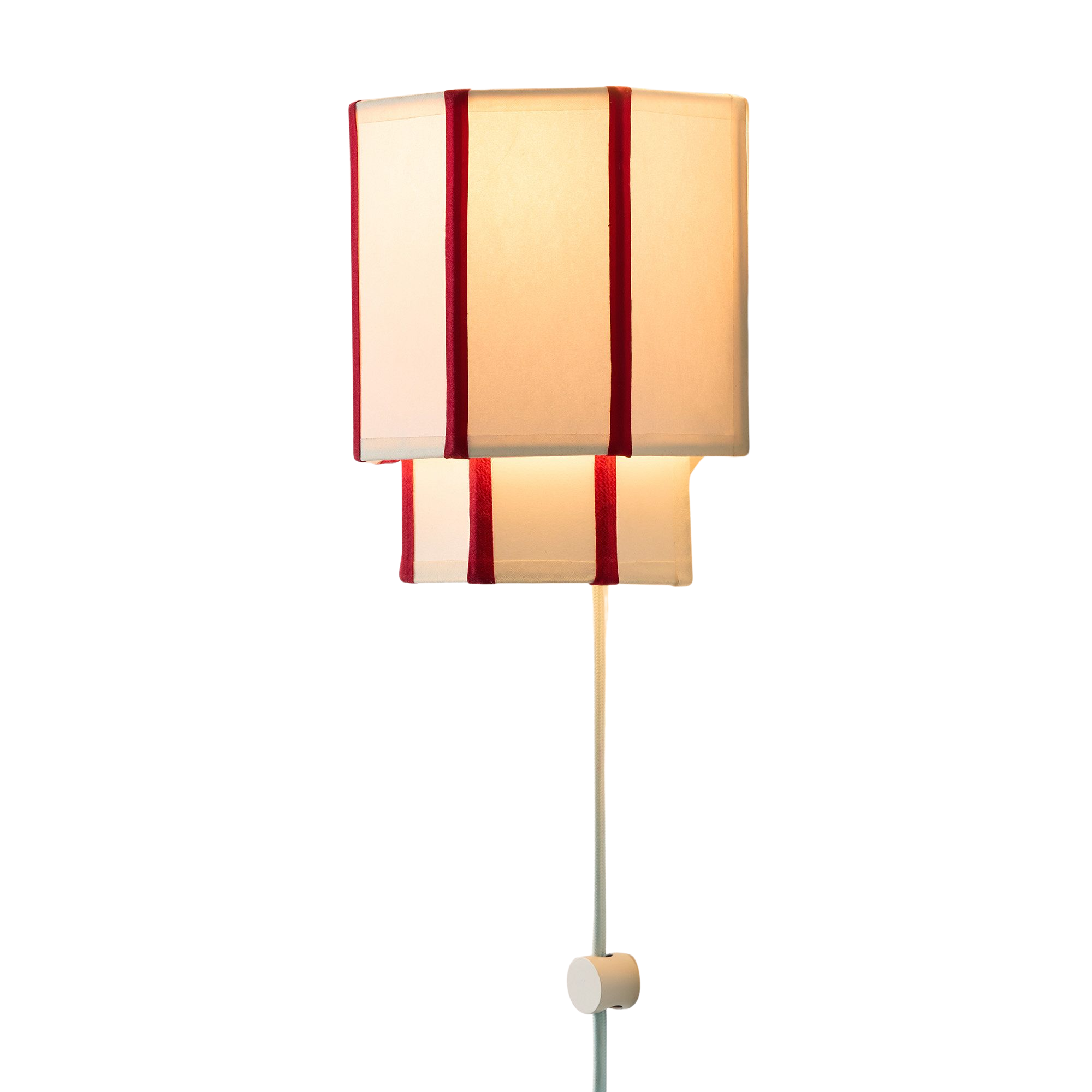 a plug in wall sconce with a fabric shade and red stripes along it