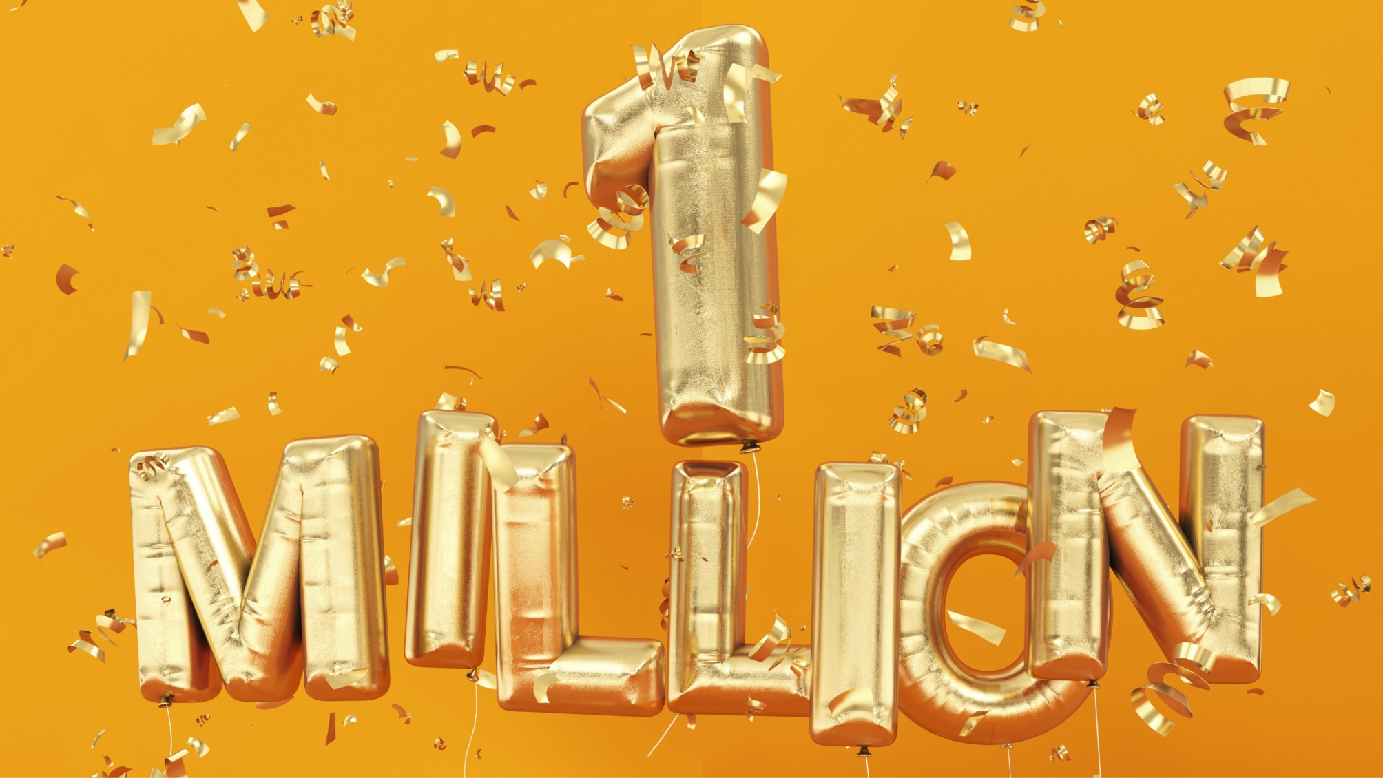 Gold helium balloons spelling out one million surrounded by confetti