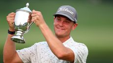 Vincent Norrman holds up the Barbasol Championship trophy after triumphing in a playoff in 2023