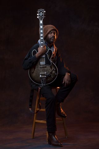 Gary Clark Jr. holds his Gibson Custom Shop ES-355 in Cobra Burst finish with Bigsby