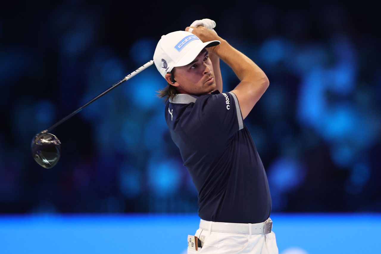 Rickie Fowler hits a driver at TGL