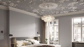 A grey and white bedroom with the emphasis on the ceiling, which has been wallpapered in grey and white floral design paper