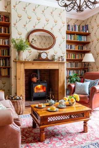 cosy living room with woodburning stove and armchairs