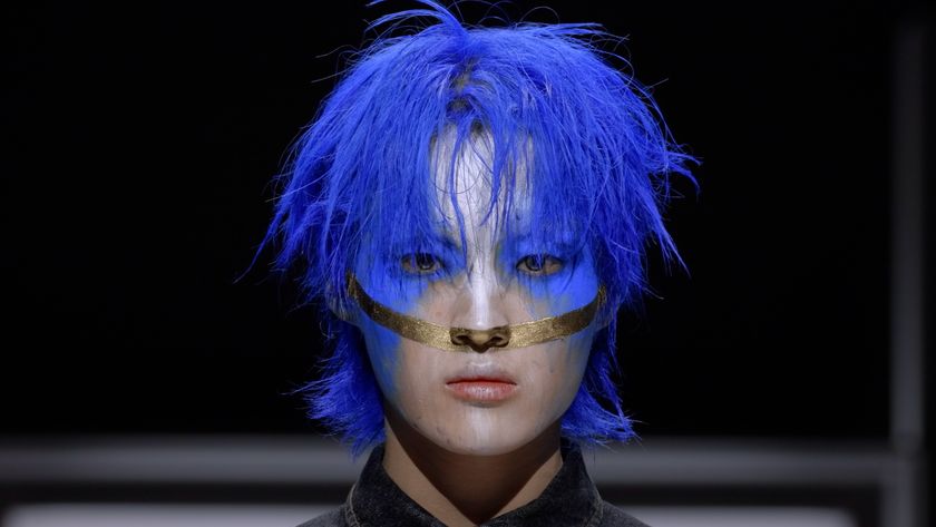 Man in blue hair in Just Makeup season 1 beauty survival show on Prime Video 