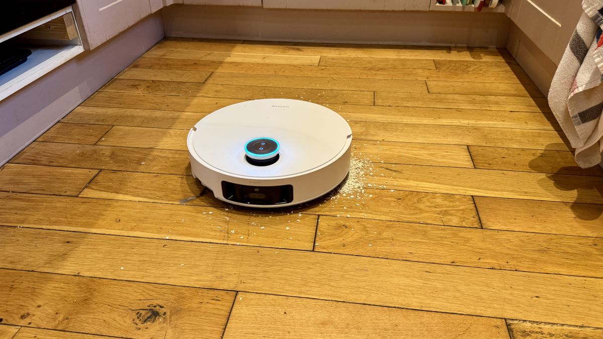 Dreame Matrix10 Ultra robot vacuum vacuuming oats from a wooden floor