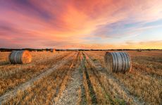 Sunset over hay bales near Crantock in Cornwall.