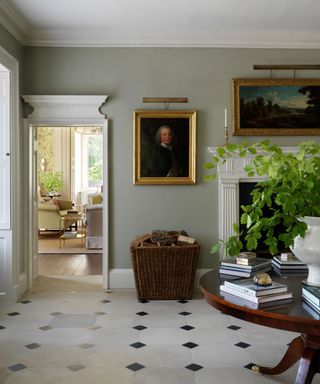 Gray-green traditional hallway with fireplace, tiled floor