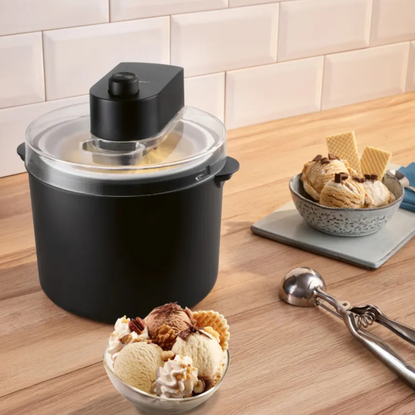 Lidl ice cream maker and two bowls of caramel ice cream next to it.