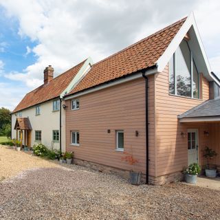 farmhouse with modern extension decorated in shades of grey and white