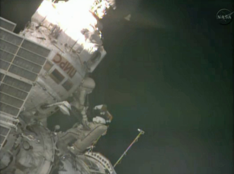 Russian cosmonauts Roman Romanenko (bottom) and Pavel Vinogradov flout outside the International Space Station on April 19, 2013, during the first spacewalk of their Expedition 35 mission.