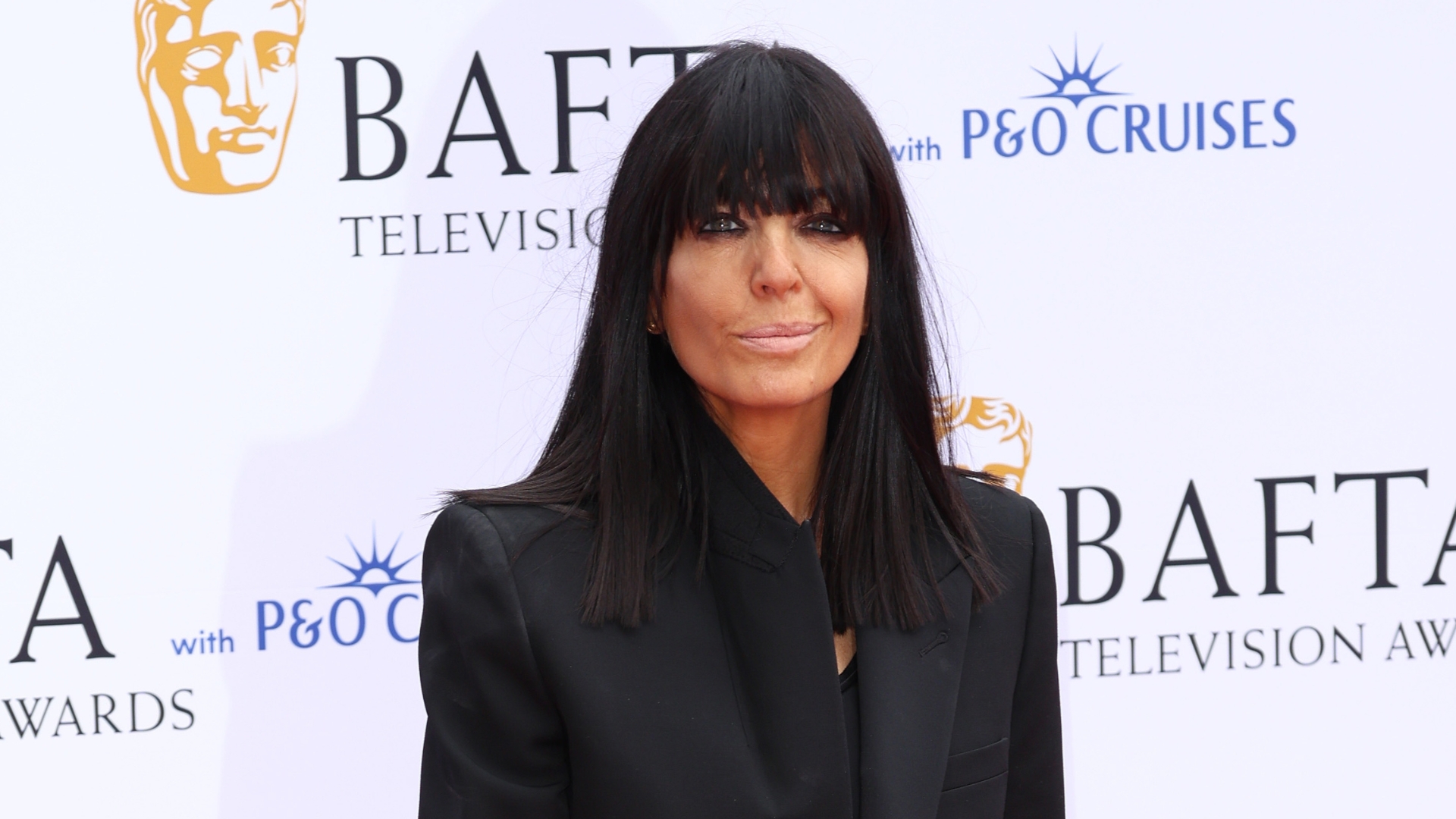 Claudia Winkleman is pictured wearing a black blazer whilst attending the BAFTA Television Awards with P&amp;O Cruises 2026 at The Royal Festival Hall on May 10, 2026 in London, England. 