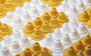 It is bell shape mould in yellow and white color