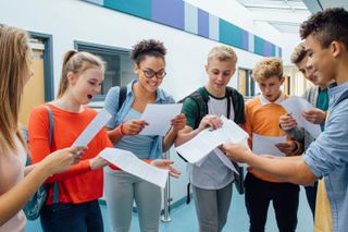 A group of young people looking at their exam results