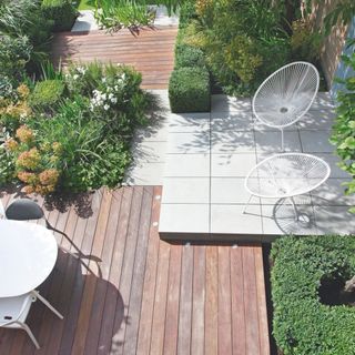 patio area with decking chairs and white table