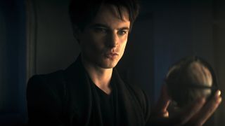 Tom Sturridge's Morpheus holding a mysterious orb in The Sandman