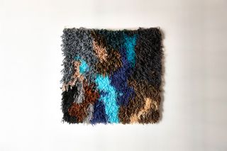 Textile artist Sarah Zapata fibre art on a white wall at the Ace Hotel Brooklyn