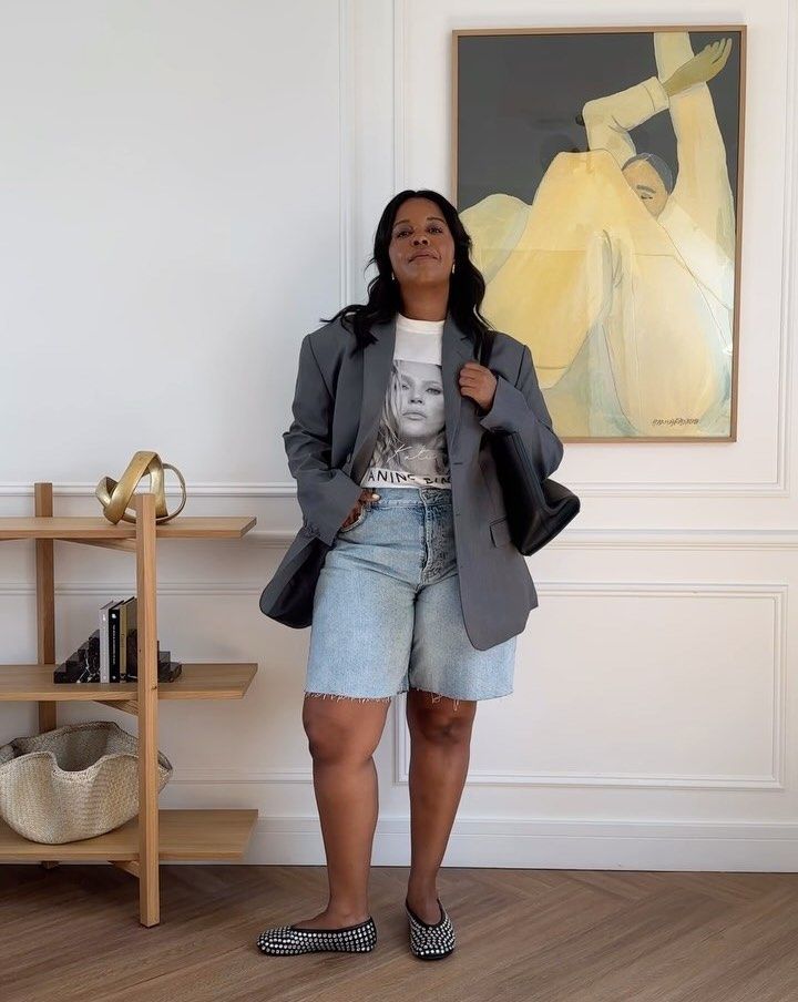 Karina in long denim shorts and a blazer