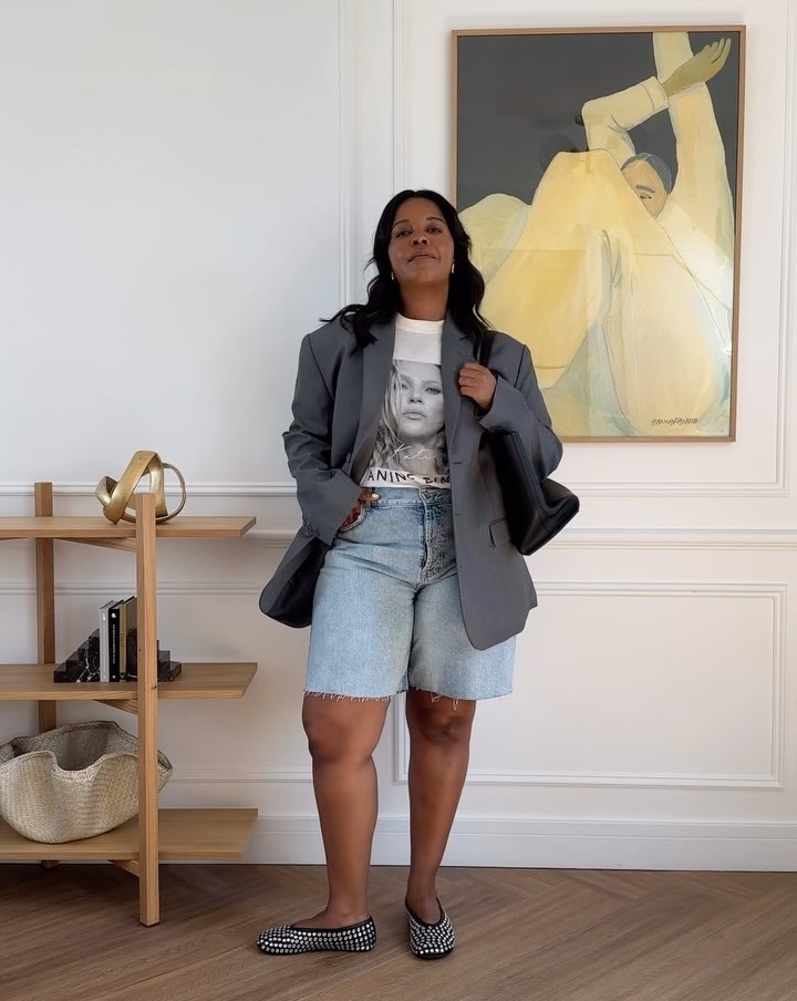 Karina in long denim shorts and a blazer