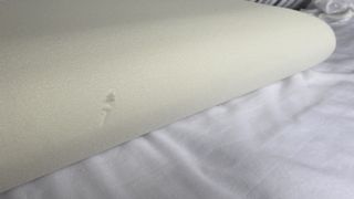 The interior foam of the Levitex Sleep Posture Pillow with a slight snag in the foam