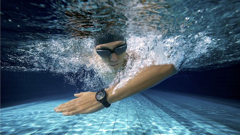 Man wearing a Huawei smartwatch while swimming