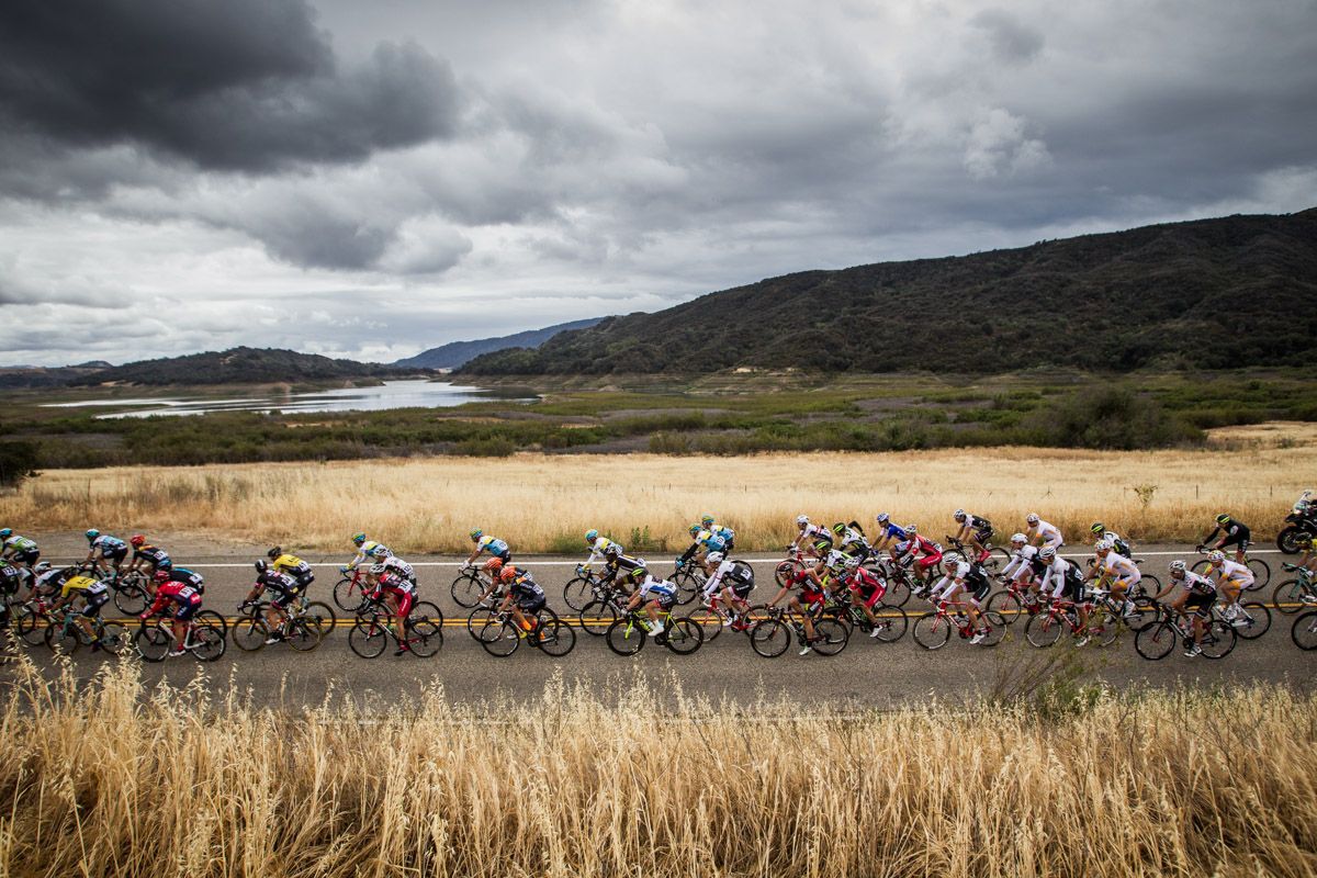 The peloton rides under ominous skies