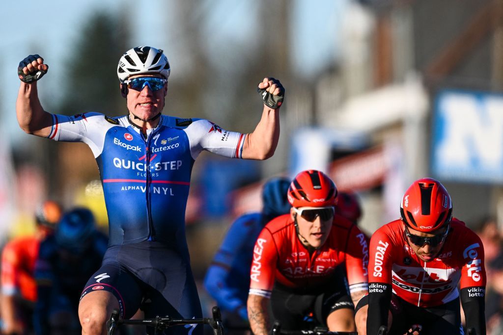 Netherlands Fabio Jakobsen of QuickStep Alpha Vinyl L celebrates as he crosses the finish line to victory ahead of Australias Caleb Ewan of Lotto Soudal R in the KuurneBrusselsKuurne one day cycling race 1951 km from Kuurne to Kuurne via Brussels on February 27 2022 Belgium OUT Photo by JASPER JACOBS Belga AFP Belgium OUT Photo by JASPER JACOBSBelgaAFP via Getty Images