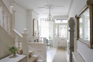 Period home hallway with plaster moulding and cornices