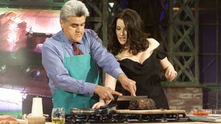 Host Jay Leno and gourmet cook Nigella Lawson during a cooking segment on April 29, 2003 -