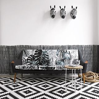 living room white walls with sofa rope and zebra skull