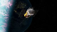 A yellow spacecraft hovers over the Earth in low-Earth orbit