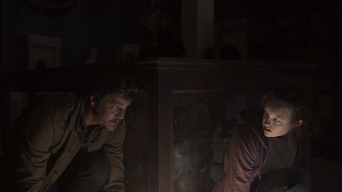 Pedro Pascal and Bella Ramsey hide from the infected in The Last Of Us