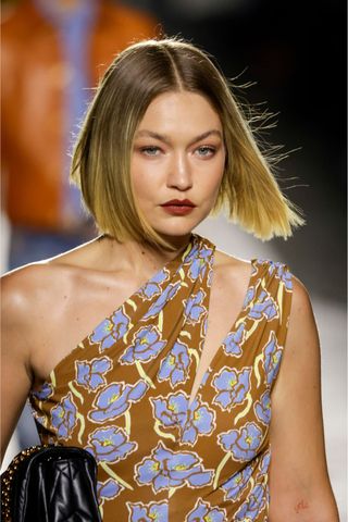 Gigi Hadid at Versace wearing the straight bob, a key Spring/Summer 2025 fashion month beauty look