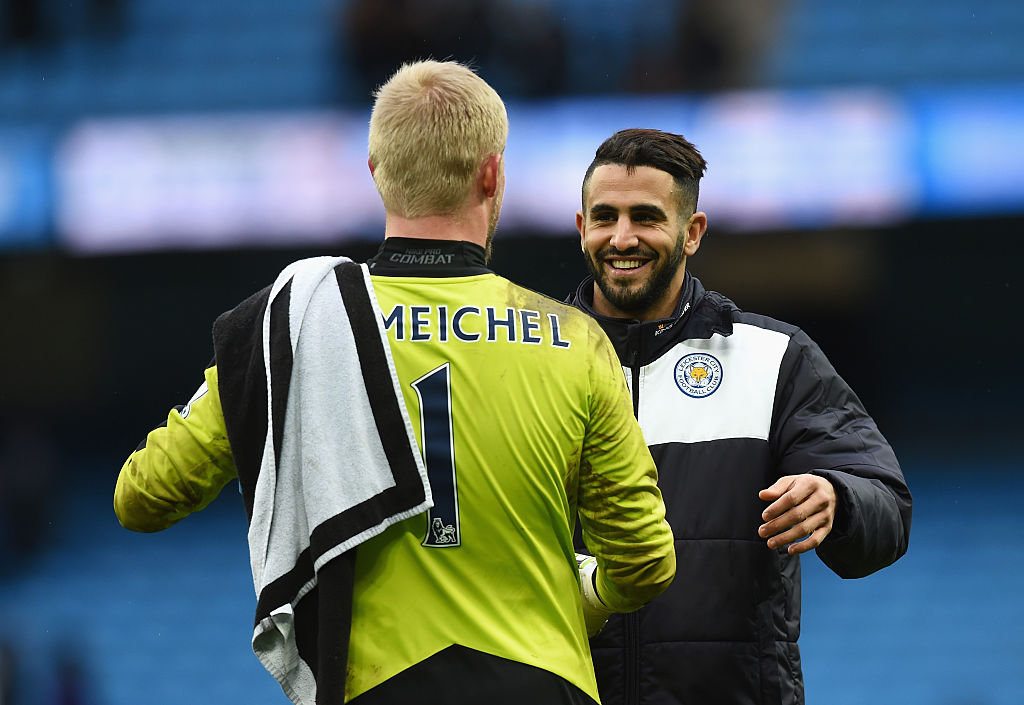 Riyad Mahrez (R) and Kasper Schmeichel (L) of Leicester City celebrate their team's win in the Barclays Premier League match between Manchester City and Leicester City at the Etihad Stadium