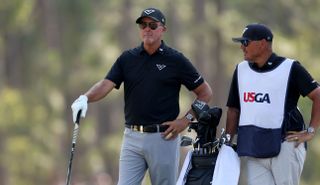 Phil Mickelson chats with his caddie at the 2024 US Open