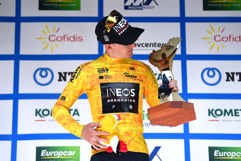GYNGYSKKESTET HUNGARY MAY 15 Eddie Dunbar of Ireland and Team INEOS Grenadiers celebrates at podium as Yellow Leader Jersey final winner during the 43rd Tour de Hongrie 2022 Stage 5 a 184km stage from Miskolc to GyngysKkestet 992m tourdehongrie on May 15 2022 in GyngysKkestet Hungary Photo by Dario BelingheriGetty Images