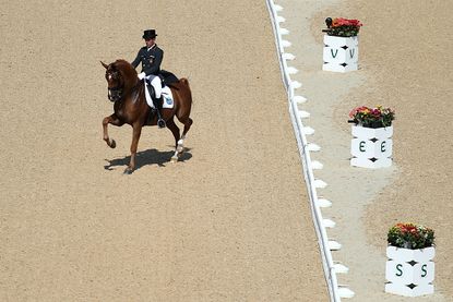 Severo Jesus Jurado Lopez of Spain led his horse in the dressage competition at the Rio Olympic Games to Santana's "Smooth."