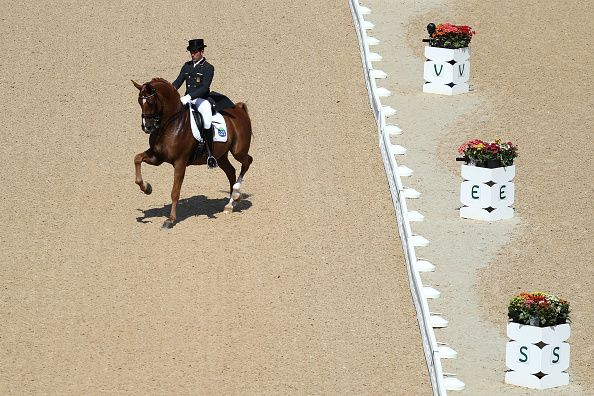 Severo Jesus Jurado Lopez of Spain led his horse in the dressage competition at the Rio Olympic Games to Santana&amp;#039;s &amp;quot;Smooth.&amp;quot;