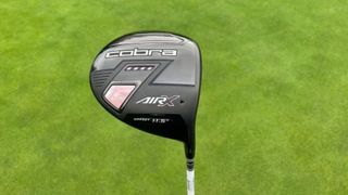 Cobra Air X Women's driver showing off its cool pink clubhead on the golf course