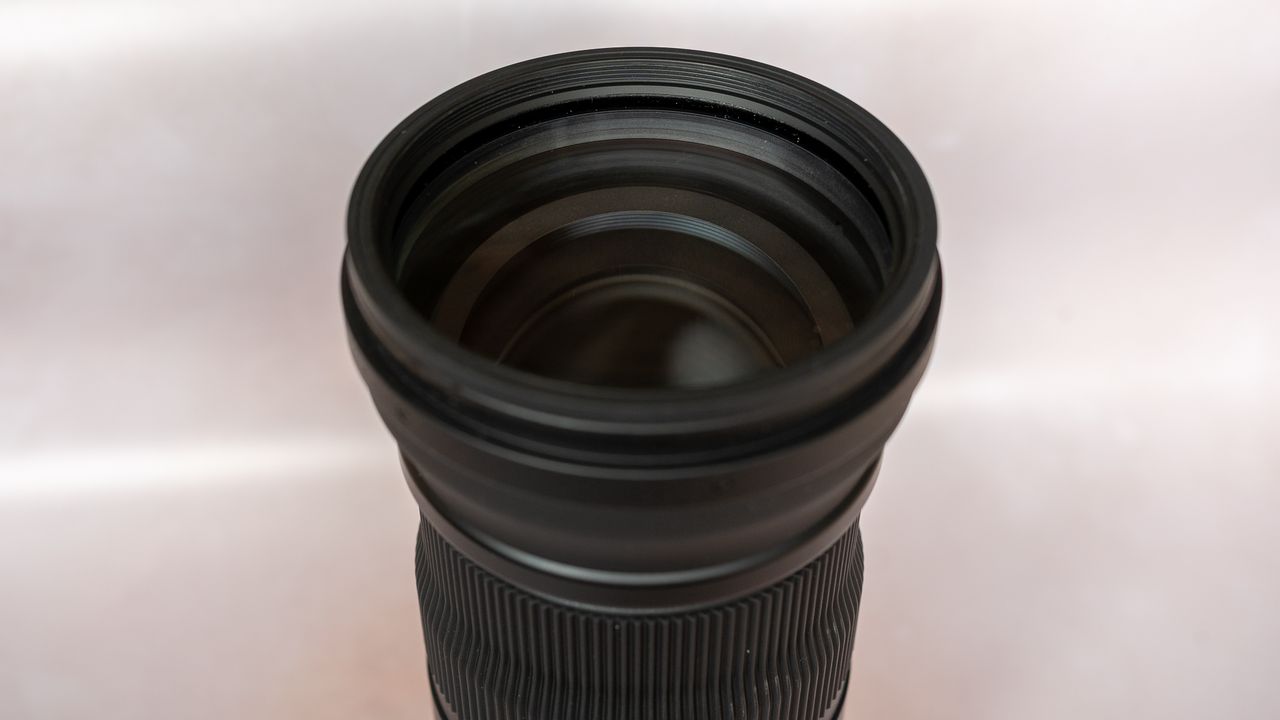 SIGMA 150-600mm f/5-6.3 DG DN OS lens on a plain background