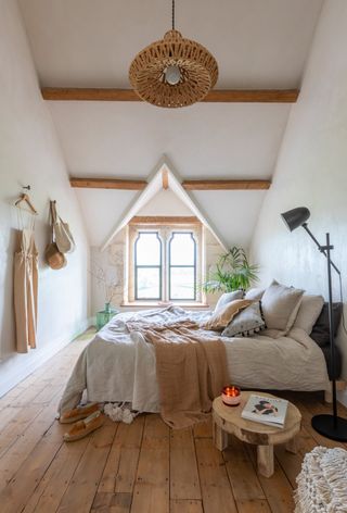 a layered textured bedroom in beige tones - Kate and Mike’s schoolhouse renovation took more than their share of blood, sweat and tears – but the unique open-plan home they’ve created is worth the effort