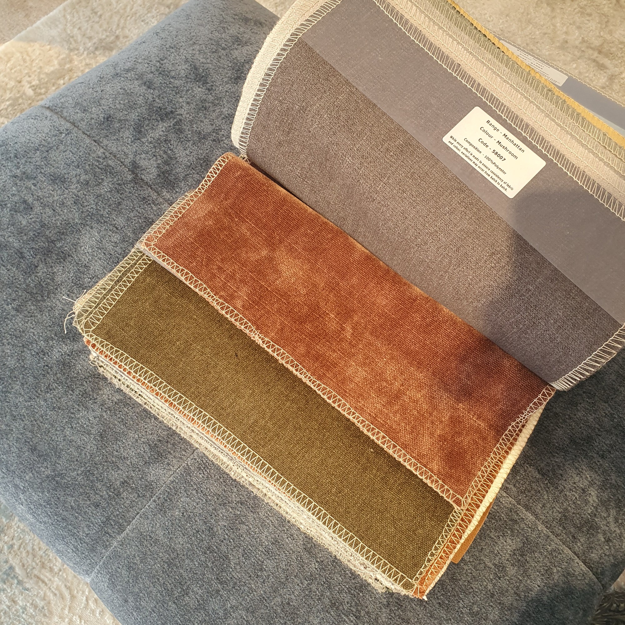 Sofa fabric swatches at a Furniture Village store