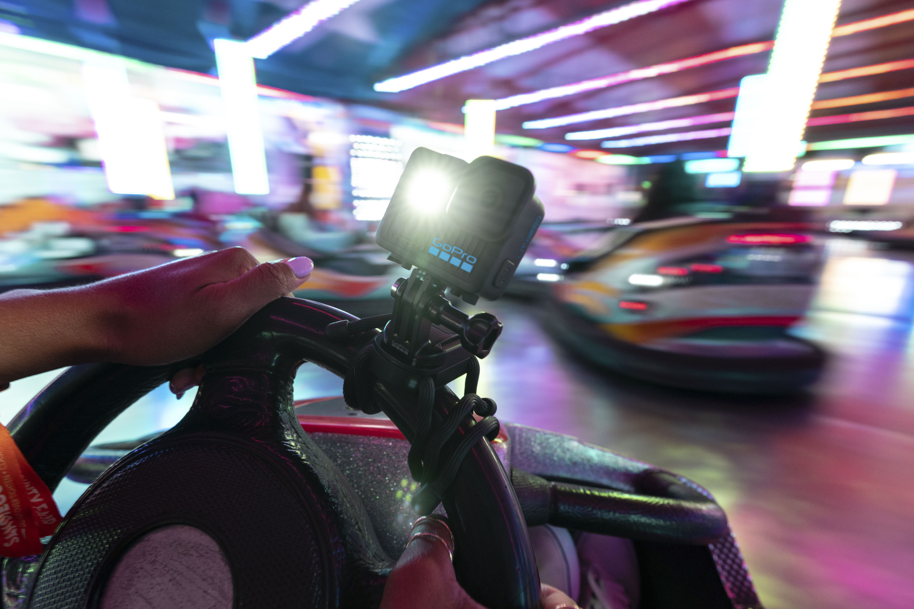 GoPro Lit Hero action cam mounted to the steering wheel of a dodge&#039;m