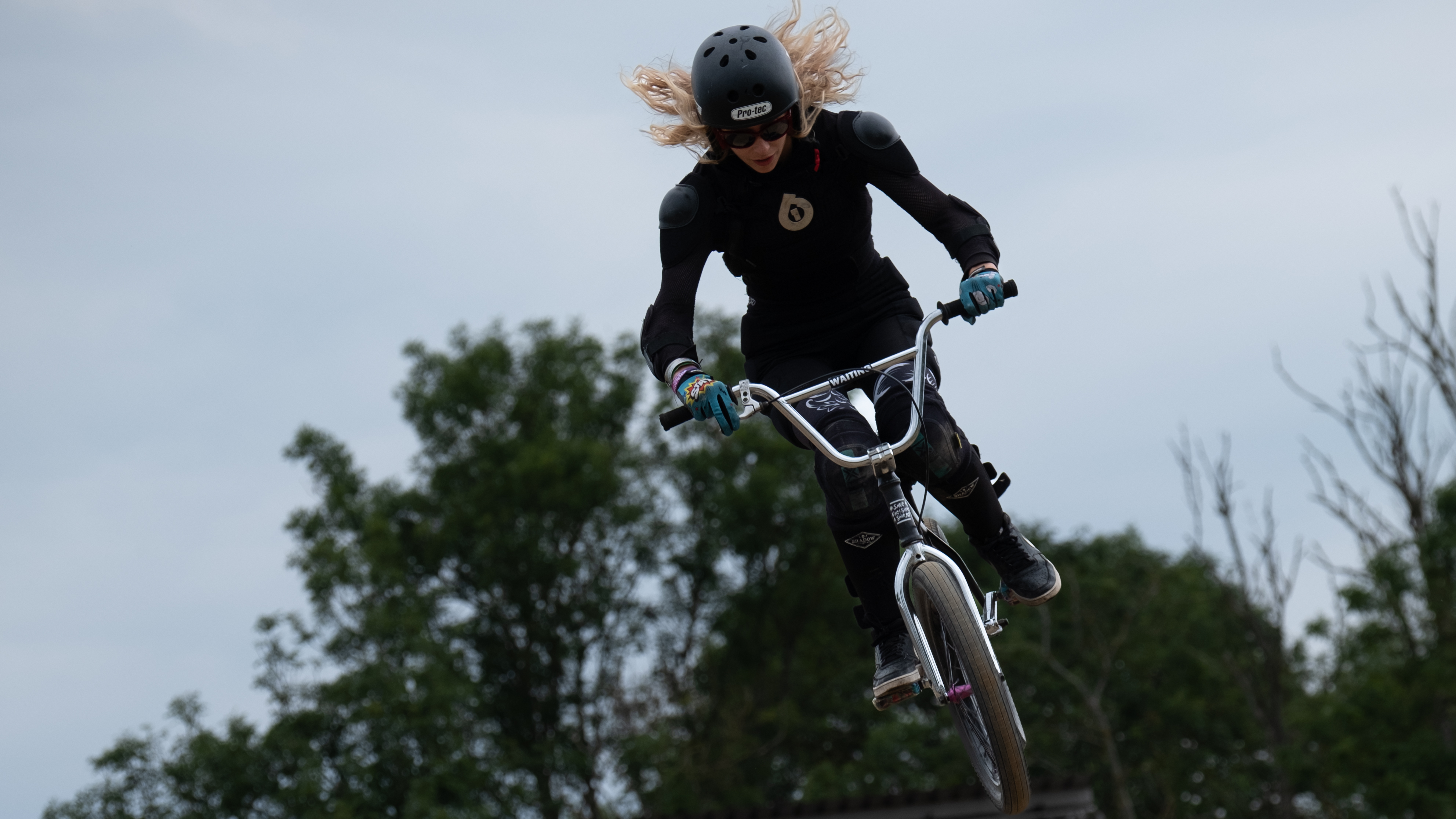 A BMX rider doing a jump on a track