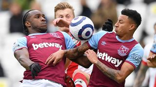 How to watch West Ham United in the Premier League - Michail Antonio (L) and Jesse Lingard jump for the ball in May 2021.