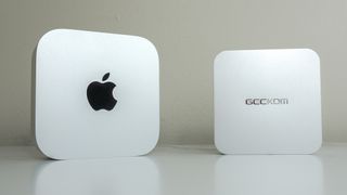 The Geekom A6 next to the Mac mini M4 on a desk