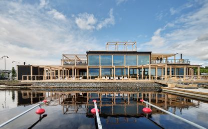 luoto sauna restaurant hero exterior with blue skies and water as example of wellness architecture