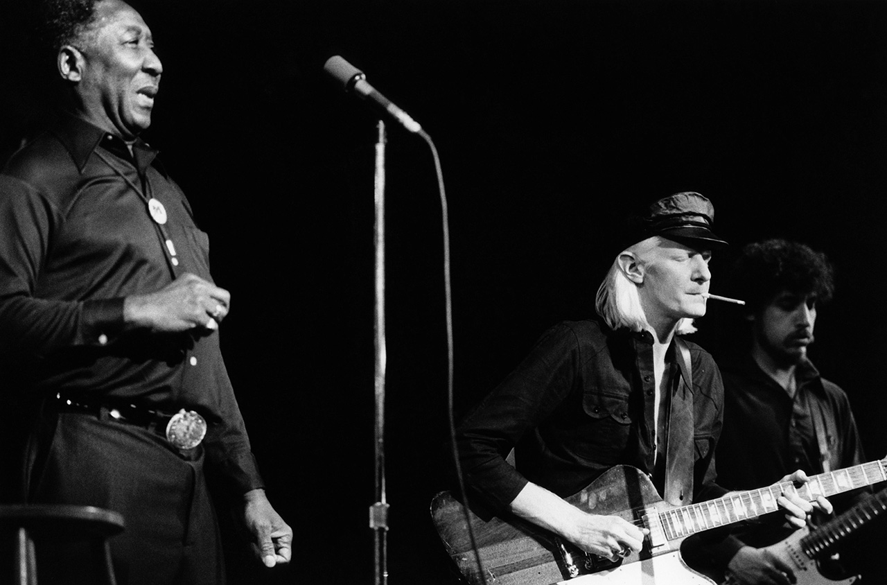 American blues singer and guitarist Muddy Waters (1913-1983) performs live on stage with guitarists Johnny Winter (in centre) and Bob Margolin at the Capital Radio Jazz Festival at Alexandra Palace in London on 21st July 1979. (Photo by David Redfern/Redferns)
