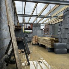 Building site with breeze block extension walls and concrete floors 